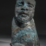 Working primarily in kilncast sculpture, Irene Frolic's works are concerned with personal identity and are widely recognized for their general emotional impact. This particular work speaks to the emotional impact texture and materials can have on the overall aesthetic of contemporary glass art.
Gift of Don and Carol Wiiken Irene Frolic (Polish/Canadian,b. 1941), Love Story Trilogy, I, 1989. Cast plate glass, silica sand and copper.
