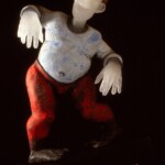 "My work is influenced by man’s reaction and adaptation to the society in which he lives. We live in a world that grows more complex and difficult to comprehend, with its tensions and temptations that pulls us in different directions. I devise surreal settings showing how we try to cope with the very limited and purely imagined space that we have created for ourselves." - David Reekie
Gift of Jeffrey Stevens David Reekie (British, b.1947), On Shaky Ground IV, 1997. Cast glass with wood base.