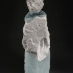 The abstract figurative forms created by New Hampshire artist Thomas Scoon incorporate self-gathered natural stone, minerals and metals with cast glass. By pairing or grouping these forms (see White Lives #4), Scoon explores familial and generational relationships in an attempt to convey personal narrative.
Gift from the collection of Jane Humzy and Peter D. Debreceny Thomas Scoon (American, b. 1961), Mate #2, 1997. Cast glass and quartz stone.