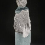 The abstract figurative forms created by New Hampshire artist Thomas Scoon incorporate self-gathered natural stone, minerals and metals with cast glass. By pairing or grouping these forms (see White Lives #4), Scoon explores familial and generational relationships in an attempt to convey personal narrative.
Gift from the collection of Jane Humzy and Peter D. Debreceny Thomas Scoon (American, b. 1961), Mate #2, 1997. Cast glass and quartz stone.