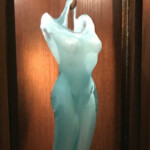 Largely influenced by her interest in human nature and the interrelationship of humans, nature and industry, Alexis Silk's work  explores objectification, body stereotypes, perceptual boxes and sexuality as strength.
On loan from the collection of Anthony and Susan Grosch Alexis Silk (American, b.1983), Lexi, Undated. Hot sculpted glass, wood and metal.