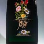 Commonly referred to as root people, Paul Stankard's earthen spirits have become a staple of his botanically realistic flameworked paperweights, combining nature with mysticism. His work represents spirituality and the life cycle of nature.
Museum purchase with funds from an anonymous donor Paul Stankard (American, b.1943), Berry Bouquet with Spirits Cloistered Botanical, 1992. Flameworked glass.