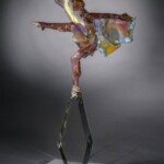 Performing arts such as music, theatre and ballet are often considered to be cathartic outlets for expression of feelings and emotion. Influenced by ten years of studying dancers in New York, Milon Townsend's flameworked sculptures focus on the depiction of movement as it relates to the performing arts.
Museum purchase in memory of Joan B. Leech Milon Townsend (American), Deco Study #2 in Butterscotch, 2002. Flameworked glass.