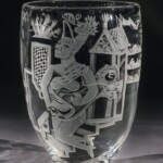 Austin, Texas-based artist Patrick Wadley used the sandblasting technique to apply vivid figurative forms to blown glass vessels and window/plate glass. The imagery of this untitled piece, featuring two humanoid forms and multiple detached hands, suggests a cry for aid, understanding or acceptance.
Gift of Carol and Don Wiiken Patrick Wadley (American, 1950-1992), Untitled, 1986. Blown and sandblasted glass.