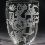 Austin, Texas-based artist Patrick Wadley used the sandblasting technique to apply vivid figurative forms to blown glass vessels and window/plate glass. The imagery of this untitled piece, featuring two humanoid forms and multiple detached hands, suggests a cry for aid, understanding or acceptance.
Gift of Carol and Don Wiiken Patrick Wadley (American, 1950-1992), Untitled, 1986. Blown and sandblasted glass.